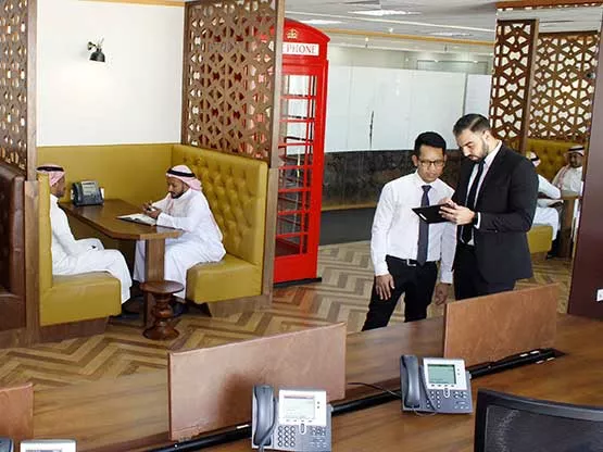 Clients are engaged in discussions at the coworking space in Olaya towers, Saudi Arabia.